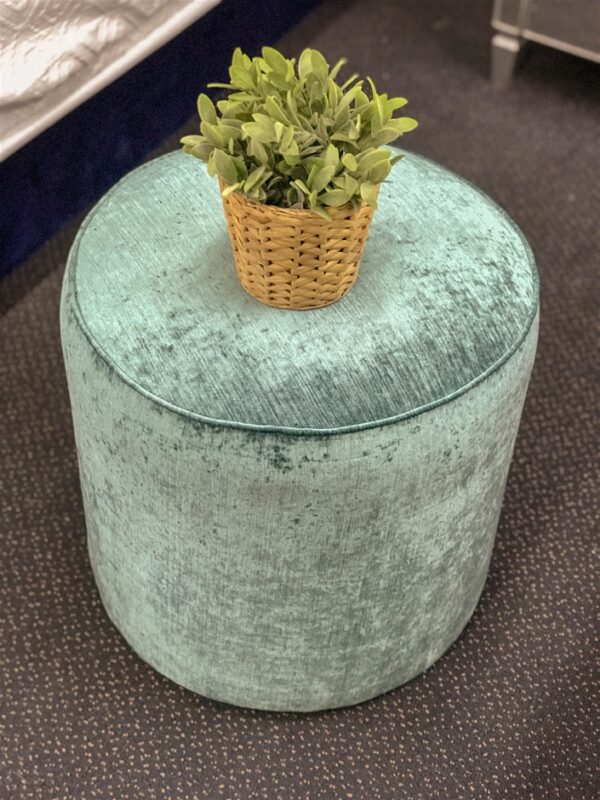 Round upholstered ottoman